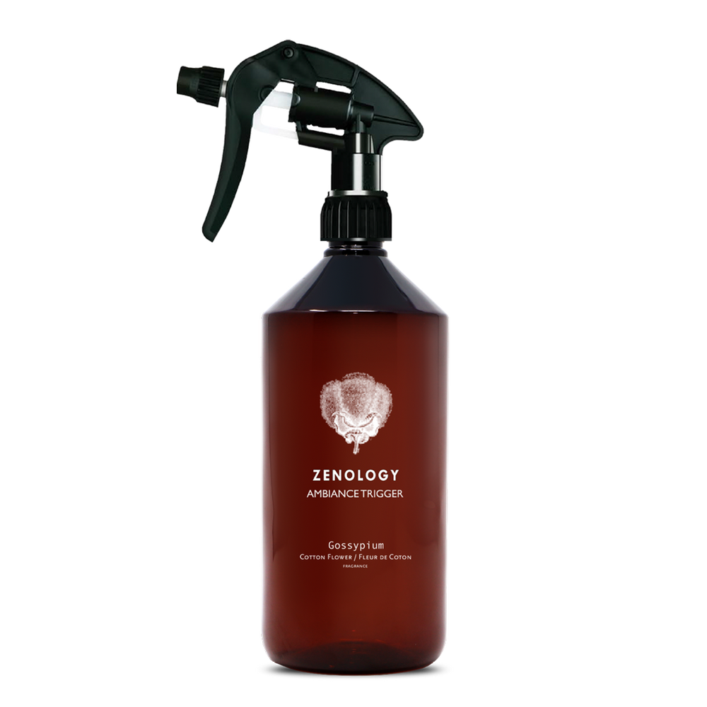 A large sized brown spray bottle labeled Zenology Ambiance Trigger Gossypium featuring an unique botanical illustration with a black spray nozzle.
