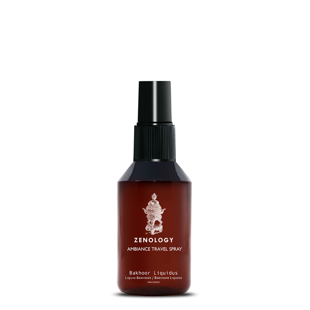 A small sized brown spray bottle labeled Zenology Ambiance Travel Spray Bakhoor Liquidus featuring an unique botanical illustration with a black spray top.