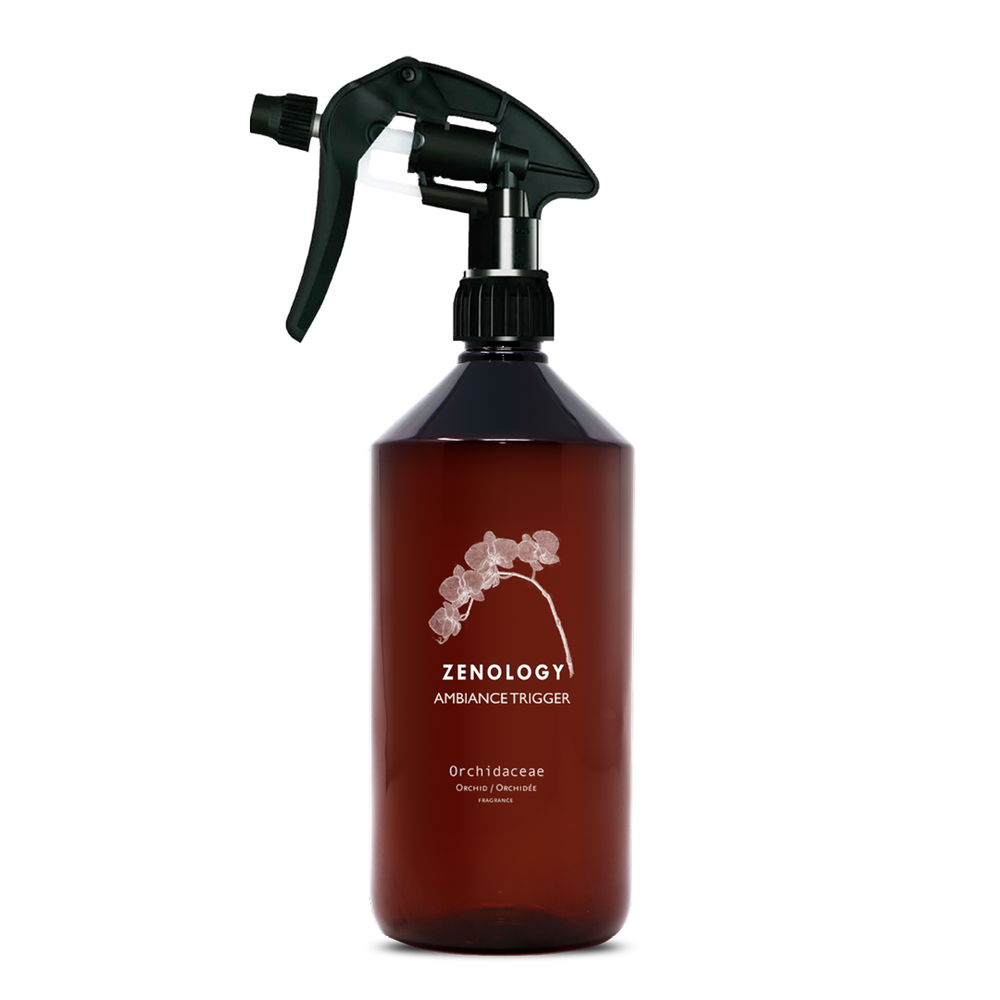 A large sized brown spray bottle labeled Zenology Ambiance Trigger Orchidaceae featuring an unique botanical illustration with a black spray nozzle.