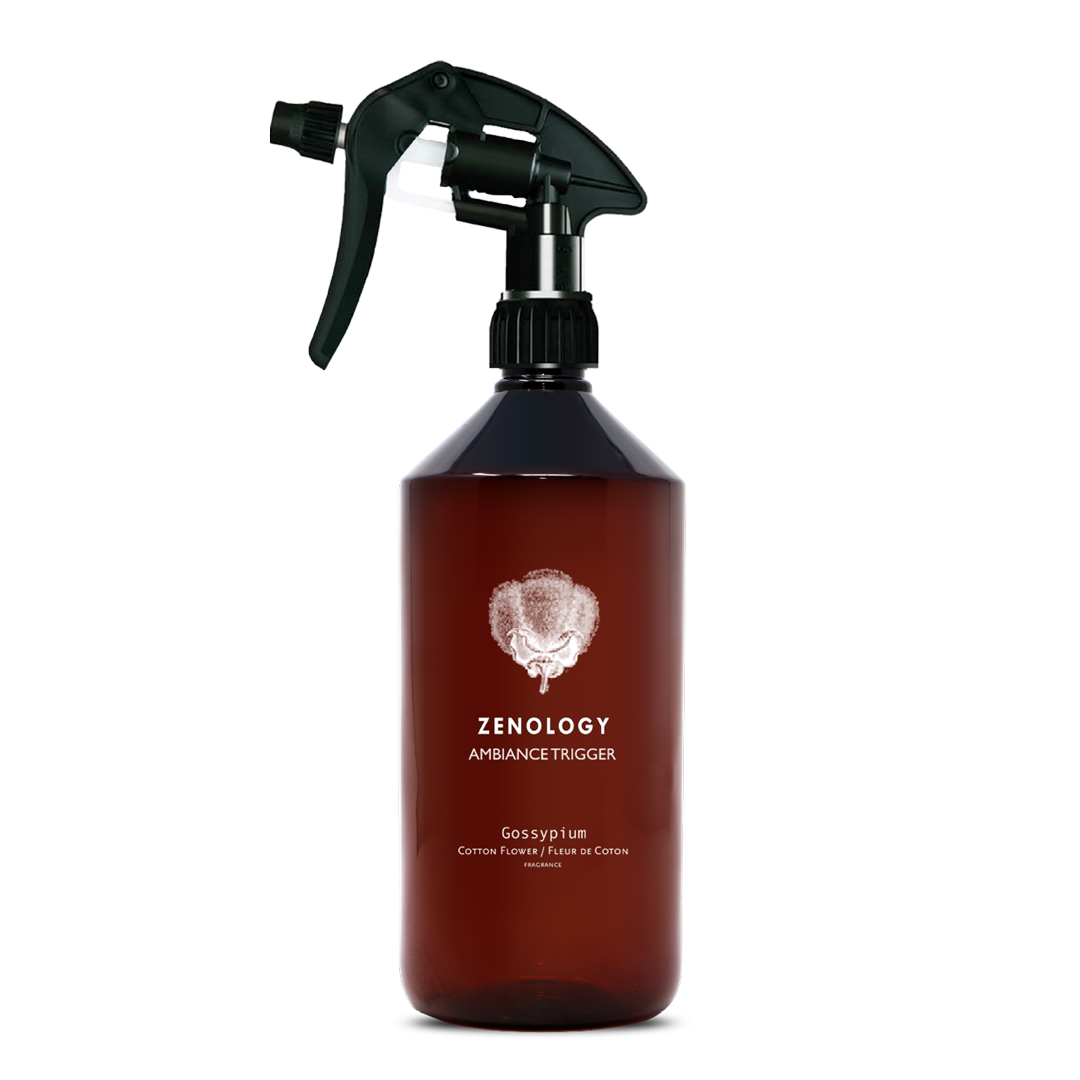 A large sized brown spray bottle labeled Zenology Ambiance Trigger Gossypium featuring an unique botanical illustration with a black spray nozzle.