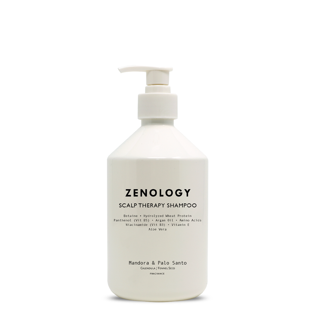 A white pump bottle labeled Zenology Scalp Therapy Shampoo Mandora & Palo Santo with a white pump.