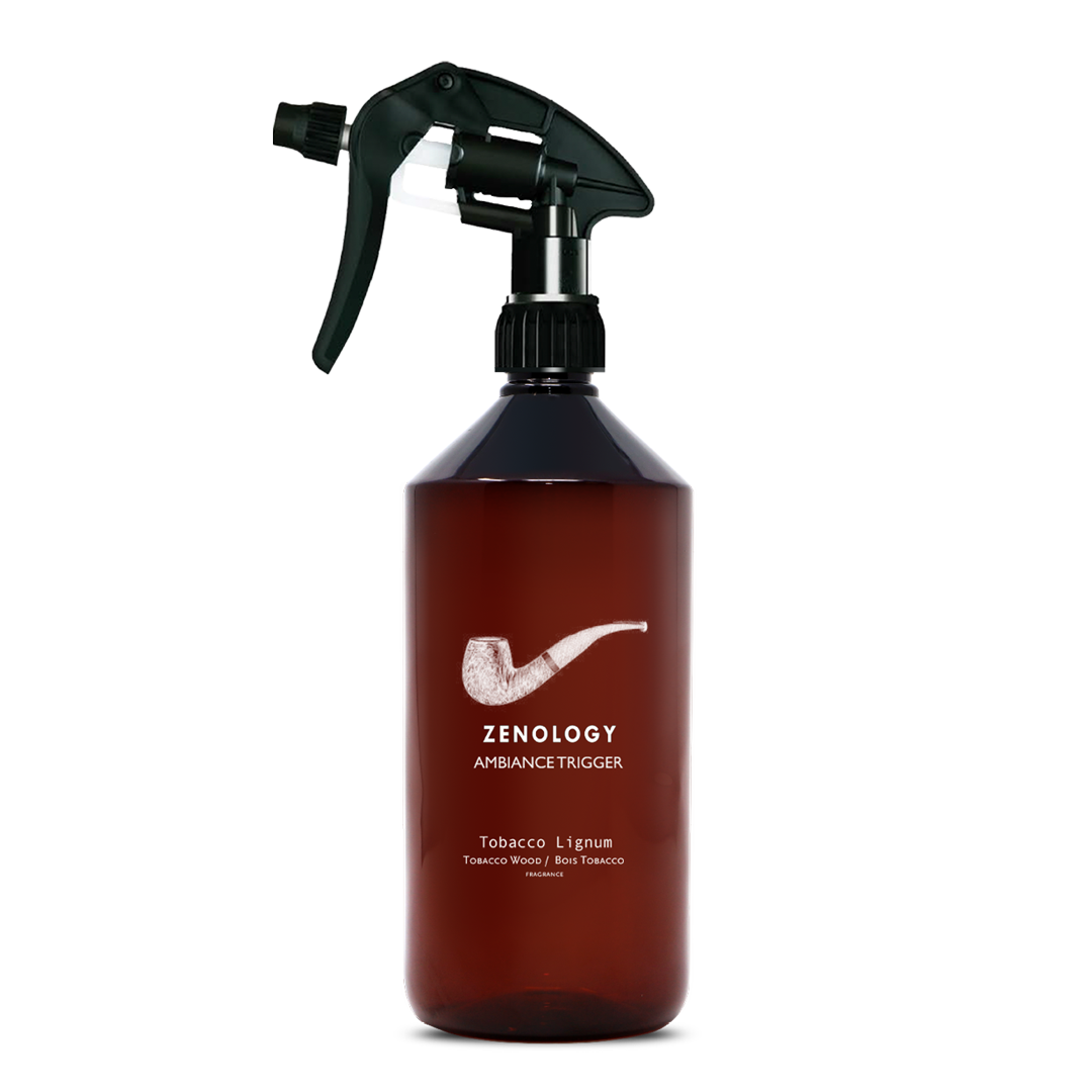 A large sized brown spray bottle labeled Zenology Ambiance Trigger Tobacco Lignum featuring an unique botanical illustration with a black spray nozzle.