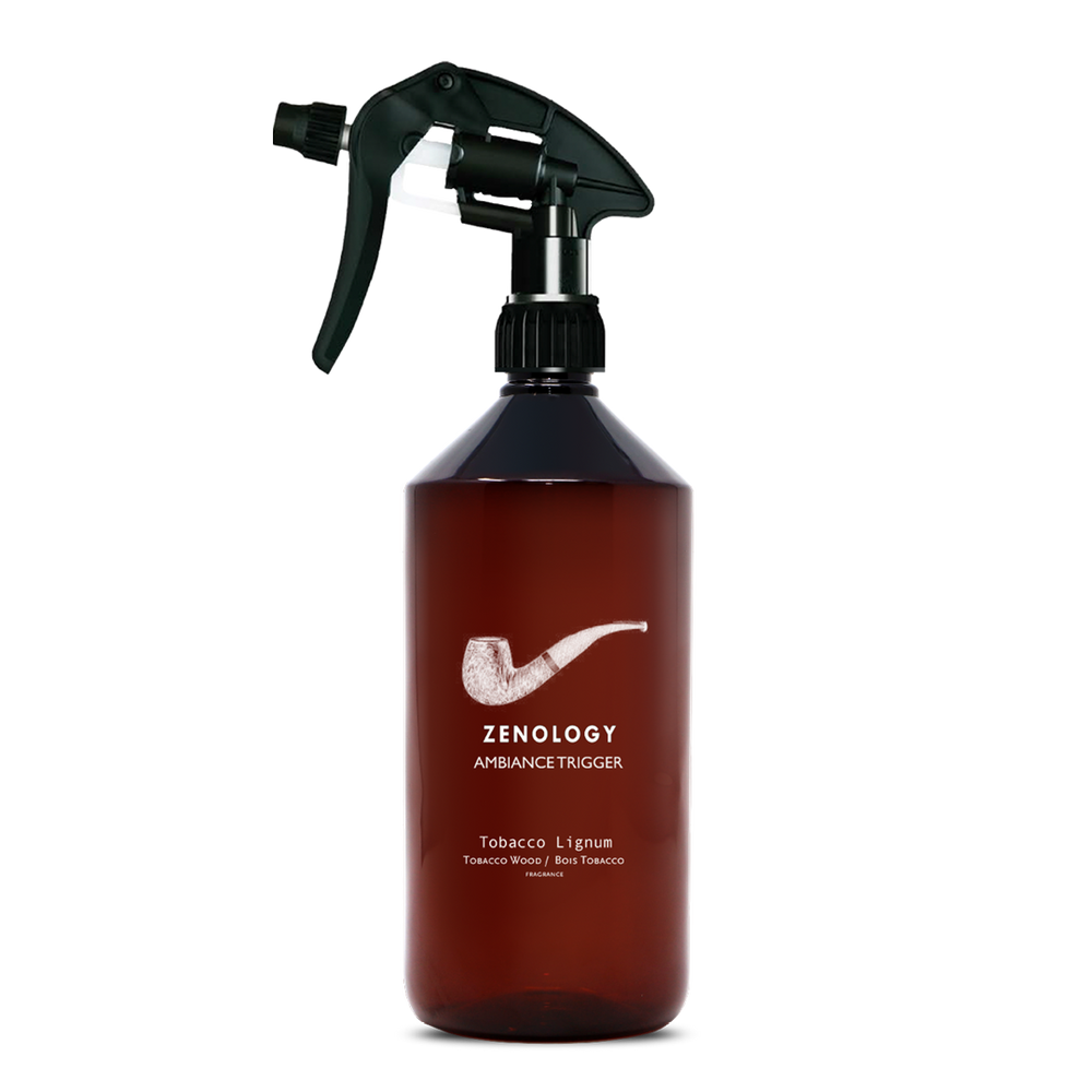 A large sized brown spray bottle labeled Zenology Ambiance Trigger Tobacco Lignum featuring an unique botanical illustration with a black spray nozzle.