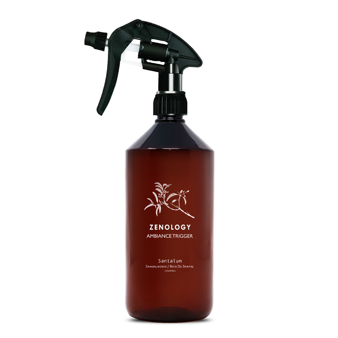 A large sized brown spray bottle labeled Zenology Ambiance Trigger Santalum featuring an unique botanical illustration with a black spray nozzle.