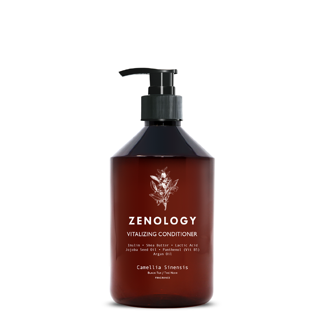 A brown pump bottle labeled Zenology Vitalizing Conditioner Camellia Sinensis featuring an unique botanical illustration and a black pump.