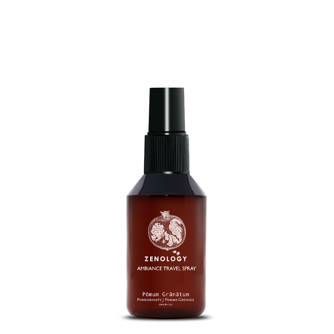 A small sized brown spray bottle labeled Zenology Ambiance Travel Spray Pōmum Grānātum featuring an unique botanical illustration with a black spray top.