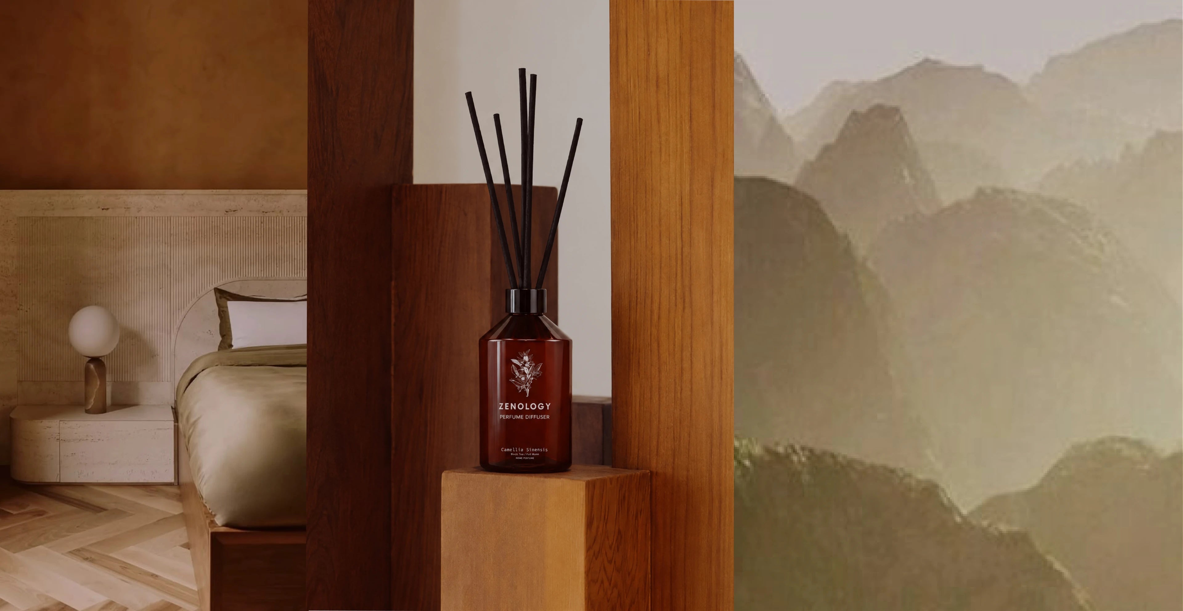 Perfume Diffuser Camellia Sinensis in amber glass with black reeds, centered between a warm interior and a tea-field landscape.
